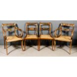 A Set of Four George IV Mahogany Dining Chairs, including Two Armchairs, the panelled crest rails