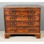 A George III Mahogany Chest, the square edge with narrow top moulding, fitted with a brushing