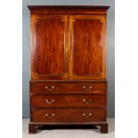 A George III Gentleman's Mahogany Wardrobe, the upper part with moulded cornice with Greek key