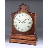 An Early Victorian Mahogany Cased Mantel Clock, the 8ins diameter repainted cream dial with Roman
