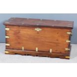 An Indian Colonial Brass Bound Teak Storage Chest, inset with shaped brass centre panel and