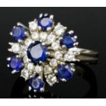 A Sapphire and Diamond Cluster Ring, Modern, in 18ct white gold mount, set with seven round