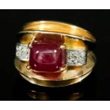 A Ruby and Diamond Ring, Modern, in gold coloured metal mount, set with central cabochon cut ruby,