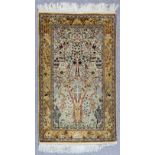 A Good Isfahan Silk "Tree of Life" Rug, woven in muted pastel shades with tree with numerous