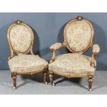 A Victorian Inlaid Walnut Framed Oval Backed Open Arm Easy Chair and Matching Nursing Chair, the