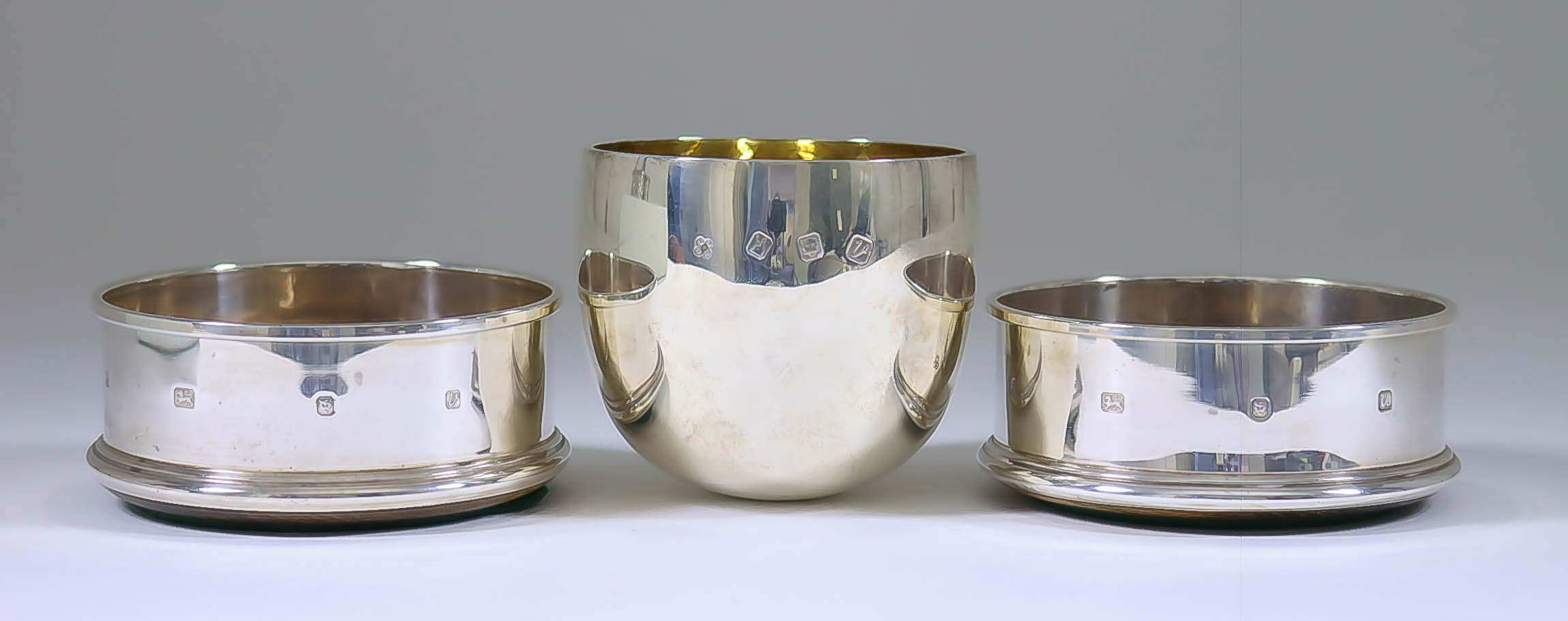 An Elizabeth II Britannia Silver and Silver Gilt Tumbler and a Pair of Elizabeth II Silver