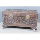A Chinese Camphor Wood Chest, the whole boldly carved with dragon's cloud motifs, sun, fish and