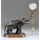 A Late 19th /Early 20th Century Continental Gilt Brass and Bronzed Spelter "Mystery" Clock, the