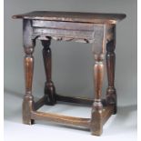 A 17th Century Oak Rectangular Joint Stool, the top with moulded edge, the shaped and moulded