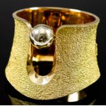 An 18ct Gold Cuff Stiff Bracelet, Modern, by Schwartz, the face of textured form and set with a