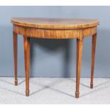 A George III Mahogany Semi Circular Card Table, the baize lined folding top crossbanded in rosewood,