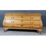 A 19th Century Continental Strip Pine Bombe Commode, fitted three long drawers, on later cabriole