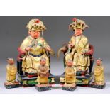 A Pair of Chinese Carved Polychrome and Gilt Wood Seated Figures of Female Goddesses Wearing