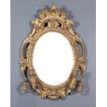 A 19th Century French Oval Two-Branch Girandole of "Rococo" Design, with C, leaf and floral carved