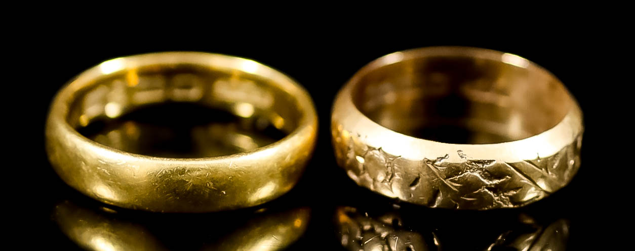 Two Gold Wedding Bands, one 22ct, size N, weight 5.5g, and one 18ct with engraved face, size J,