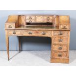 A Late Victorian Oak "Carlton House" Style Desk, the superstructure fitted three cupboards
