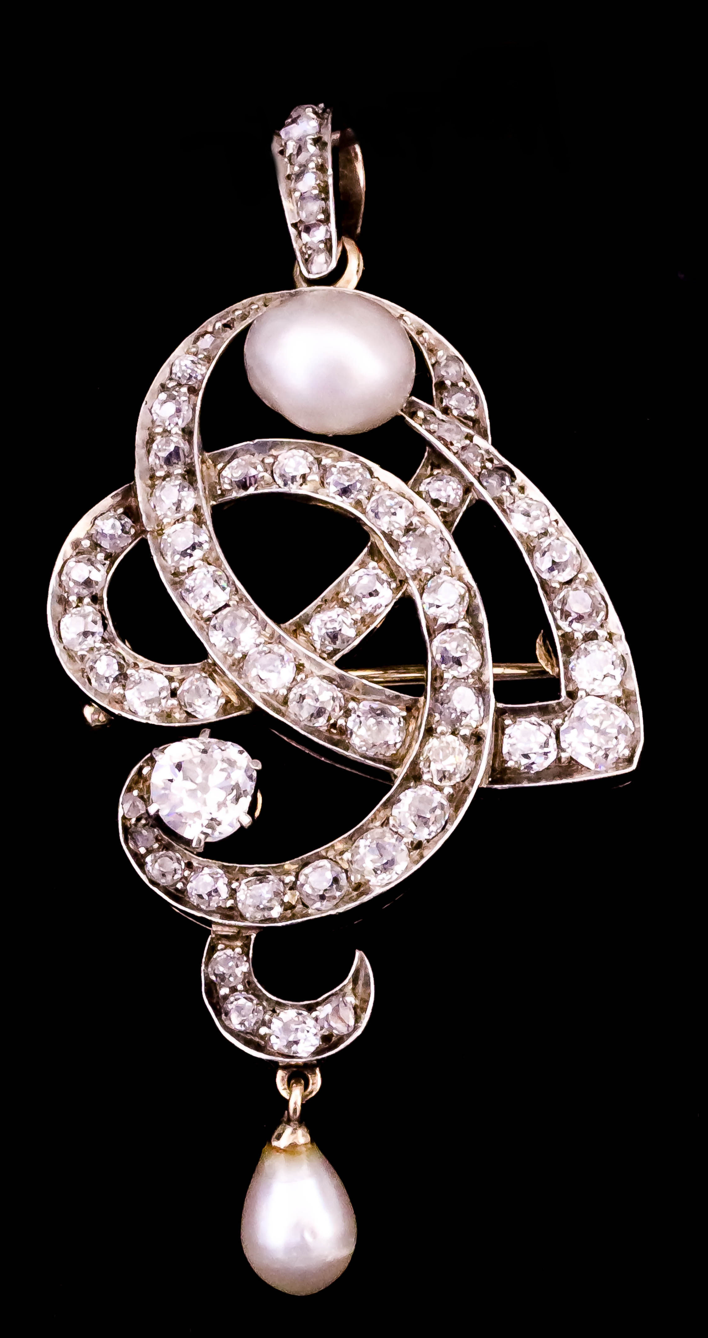 A Diamond and Pearl Brooch or Pendant at Will, 19th Century, in 14ct gold mount of entwined scroll