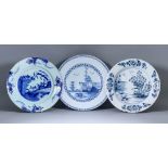 An English Blue and White Delft Charger, 18th Century, painted with a pavilion and trees on an