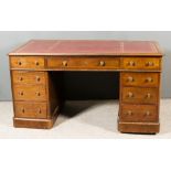 A Late Victorian Mahogany Kneehole Desk, with red leather inset to top, moulded edge and rounded