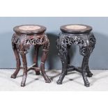 A Pair of Late 19th Century Chinese Rosewood Circular Jardiniere Stands, inset with circular pink