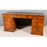 A Late Victorian Mahogany Kneehole Desk, with navy blue leather inset to top and square edge, fitted