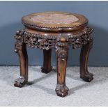 A Late 19th Century Chinese Rosewood Circular Jardiniere Stand, the slightly shaped top inset with