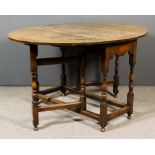 An Oak Oval Gateleg Table of "18th Century" Design, the plain top with square edge, on slender