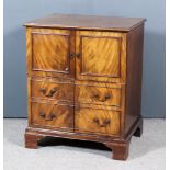 A George III Mahogany Night Commode, the lifting top with moulded edge, now fitted with a cupboard