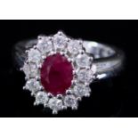 A Ruby and Diamond Ring, Modern, in 18ct white gold mount, the centre set with a ruby, approximate