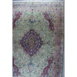 A Fine Tabriz Carpet, Early 20th Century, woven in colours with floral filled lozenge shaped
