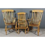 Two Beechwood and Elm Seated High Back Windsor Armchairs and a Satin Walnut Folding Armchair, the