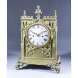 An Early 19th Century Cast Brass Gothic Pattern Cased Mantel Clock, the 5ins diameter silvered