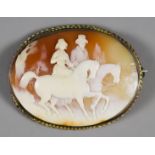 An Oval Cameo Brooch, Circa 1870, in gilt metal mount, carved with figures on horseback, 2ins x 2.