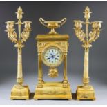 A Mid 19th Century French Gilt Brass and Siena Marble Three-Piece Clock Garniture of "Empire"