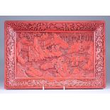 A Chinese Cinnabar Lacquer Tray, deeply carved with figures within a pavilioned landscape, 10ins (