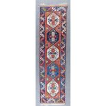 A Turkish Runner of Kazak Design, Modern, woven in colours with five stepped hexagonal motifs on a