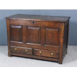An 18th Century Panelled Oak Mule Chest, with plain lid, three fielded panels to front, fitted two