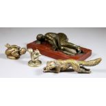 Late 19th Century Continental School - Bronze figure of a recumbent female, on polished red marble