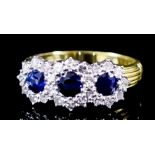 A Sapphire and Diamond Ring, Modern, in 18ct gold mount, set with three sapphires, approximate total