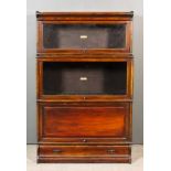 A 1920's Globe Wernicke Stained Wood Three-Tier Sectional Bookcase, two tiers with glazed rising