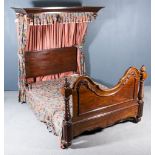 A Victorian Mahogany 4ft 6ins Half Tester Bedstead, with deep moulded cornice, shaped and moulded