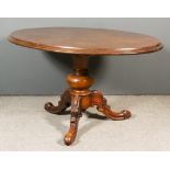 A Victorian Mahogany Oval Breakfast Table, the plain solid top with moulded edge and apron, on heavy