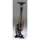 A Japanese Bronze Candlestick, Meiji Period, modelled as a monkey holding a large gourd, with finely