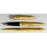 A Parker 61 "Presidential" 18ct Gold Cased Fountain Pen and Biro Set, with textured bodies, case