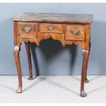 A Mid 18th Century Walnut Lowboy, the quarter veneered top inlaid with herringbone banding and
