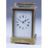 A Late 19th/Early 20th Century French Carriage Clock, the white enamel dial with Roman numerals,