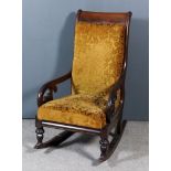 A Victorian Mahogany Framed Scroll Back Rocking Chair, the seat and back upholstered in cut