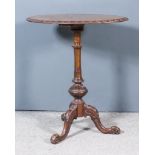 A Victorian Figured Walnut Oval Tripod Table, the quarter veneered top inlaid with boxwood leaf