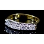 A Seven Stone Diamond Ring, Modern, in 18ct yellow gold mount, set with seven round brilliant cut