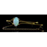 An Opal Bar Brooch, 20th Century, in 18ct gold mount, set with triplet opal, 10mm x 6mm, 50mm